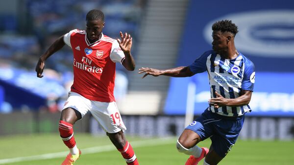 Arsenal's French-born Ivorian midfielder Nicolas Pepe (L) and Brighton's Ivorian midfielder Yves Bissouma compete during the English Premier League football match between Brighton and Hove Albion and Arsenal at the American Express Community Stadium in Brighton, southern England on June 20, 2020. (Photo by Mike Hewitt / POOL / AFP) / RESTRICTED TO EDITORIAL USE. No use with unauthorized audio, video, data, fixture lists, club/league logos or 'live' services. Online in-match use limited to 120 images. An additional 40 images may be used in extra time. No video emulation. Social media in-match use limited to 120 images. An additional 40 images may be used in extra time. No use in betting publications, games or single club/league/player publications. / Arsenal's French-born Ivorian midfielder Nicolas Pepe (L) and Brighton's Ivorian midfielder Yves Bissouma compete during the English Premier League football match between Brighton and Hove Albion and Arsenal at the American Express Community Stadium in Brighton, southern England on June 20, 2020. (Photo by Mike Hewitt / POOL / AFP) / RESTRICTED TO EDITORIAL USE. No use with unauthorized audio, video, data, fixture lists, club/league logos or 'live' services. Online in-match use limited to 120 images. An additional 40 images may be used in extra time. No video emulation. Social media in-match use limited to 120 images. An additional 40 images may be used in extra time. No use in betting publications, games or single club/league/player publications. /