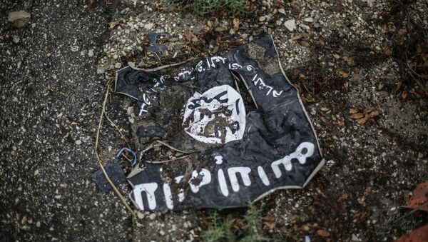 Флаг радикальной исламистской организации Исламское государство Ирака и Леванта. Архивное фото Флаг радикальной исламистской организации Исламское государство Ирака и Леванта. Архивное фото