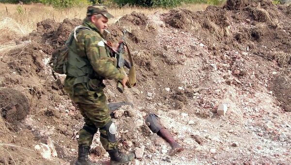 Под Донецком найдены захоронения мирных жителей Под Донецком найдены захоронения мирных жителей