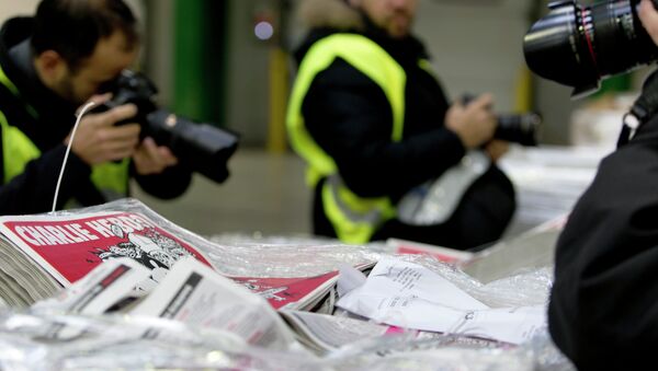 Номер Charlie Hebdo. Архивное фото Номер Charlie Hebdo. Архивное фото