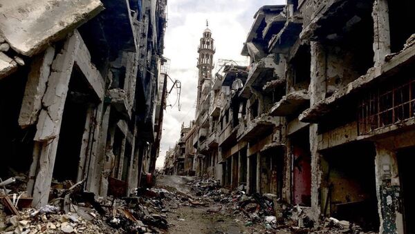 Разрушенные здания в сирийском городе Хомсе. Архивное фото Разрушенные здания в сирийском городе Хомсе. Архивное фото