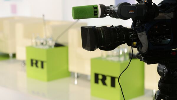 Лого телеканала Russia Today. Архивное фото Лого телеканала Russia Today. Архивное фото
