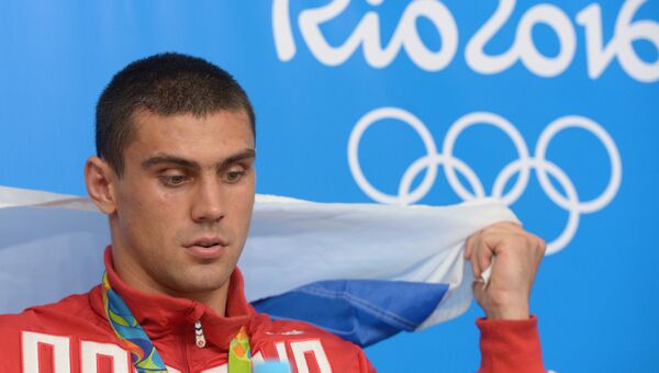 Российский боксер Евгений Тищенко, завоевавший золотую медаль на XXXI летних Олимпийских играх Российский боксер Евгений Тищенко, завоевавший золотую медаль на XXXI летних Олимпийских играх