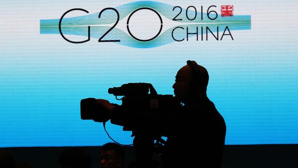 Телеоператор во время саммита G20 в Ханчжоу, КНР Телеоператор во время саммита G20 в Ханчжоу, КНР