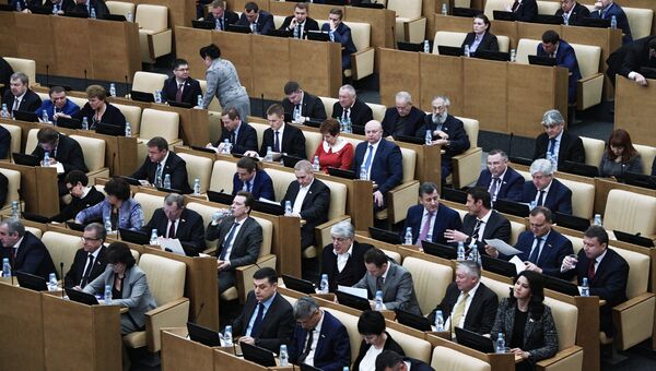 Депутаты на пленарном заседании Государственной Думы РФ. Архивное фото Депутаты на пленарном заседании Государственной Думы РФ. Архивное фото