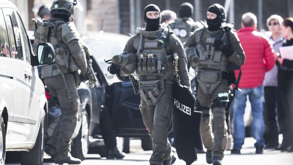 Сотрудники полиции у в Германии. Архивное фото Сотрудники полиции у в Германии. Архивное фото