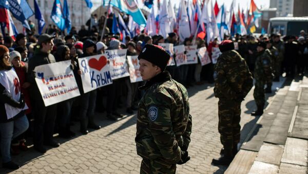 Участники митинга в честь третьей годовщины воссоединения Крыма с Россией в Омске Участники митинга в честь третьей годовщины воссоединения Крыма с Россией в Омске