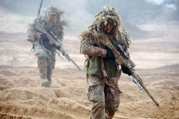 Военнослужащие НАТО во время учений в Латвии Военнослужащие НАТО во время учений в Латвии