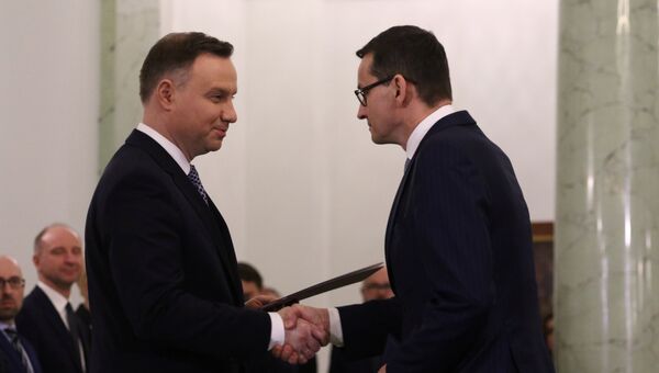 Президент Польши Анджей Дуда и назначенный премьер-министр Польши Матеуш Моравецкий в Варшаве, Польша. 11 декабря 2017 Президент Польши Анджей Дуда и назначенный премьер-министр Польши Матеуш Моравецкий в Варшаве, Польша. 11 декабря 2017