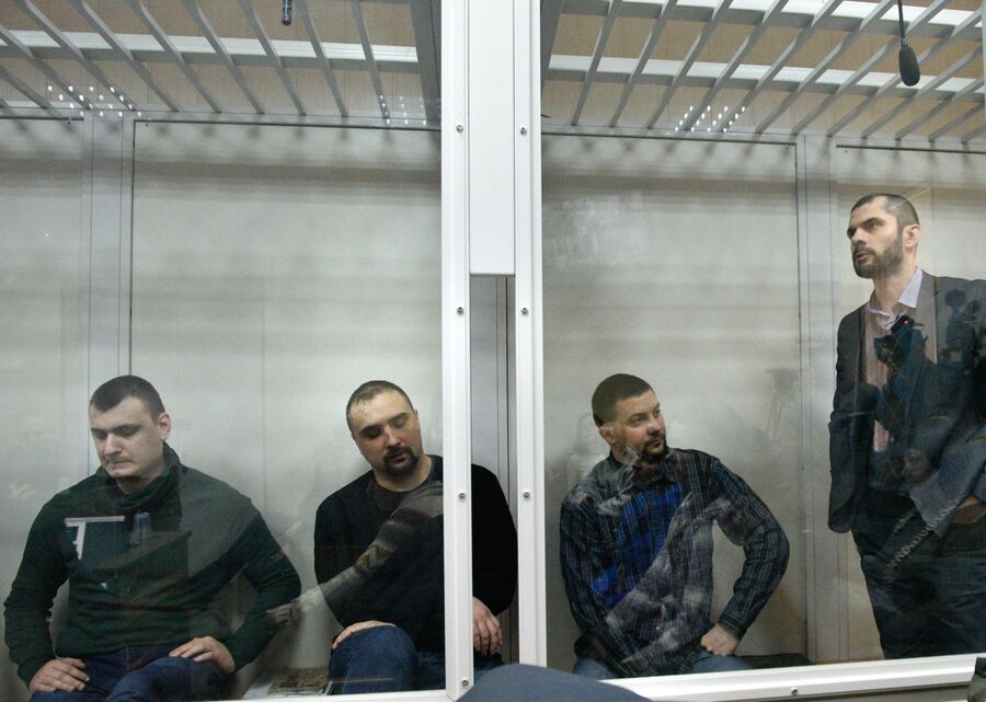 Бывшие бойцы спецподразделения МВД Беркут во время заседания в Святошинском районном суде Киева. 13 февраля 2018 Бывшие бойцы спецподразделения МВД Беркут во время заседания в Святошинском районном суде Киева. 13 февраля 2018