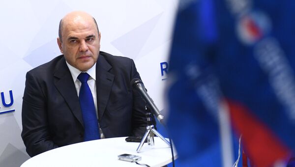 Руководитель Федеральной налоговой службы РФ Михаил Мишустин во время интервью на стенде Международного информационного агентства Россия сегодня на IV Восточном экономическом форуме Руководитель Федеральной налоговой службы РФ Михаил Мишустин во время интервью на стенде Международного информационного агентства Россия сегодня на IV Восточном экономическом форуме