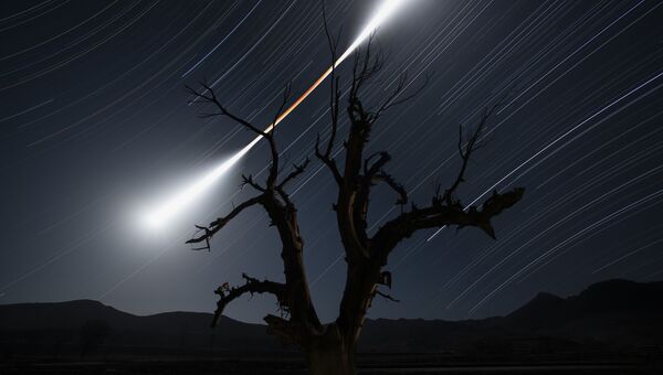 Работа фотографа Chuanjin Su Eclipsed Moon Trail. Конкурс Insight Astronomy Photographer of the year 2018 Работа фотографа Chuanjin Su Eclipsed Moon Trail. Конкурс Insight Astronomy Photographer of the year 2018