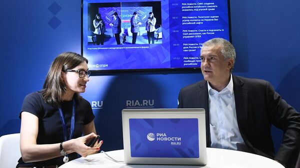 Глава Республики Крым Сергей Аксёнов дает интервью на стенде МИА Россия сегодня в рамках Ялтинского международного экономического форума. 19 апреля 2019