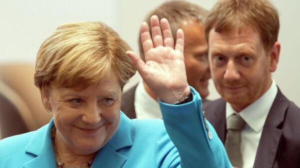 Канцлер Германии Ангела Меркель и премьер-министр Саксонии Михаэль Кречмер Канцлер Германии Ангела Меркель и премьер-министр Саксонии Михаэль Кречмер