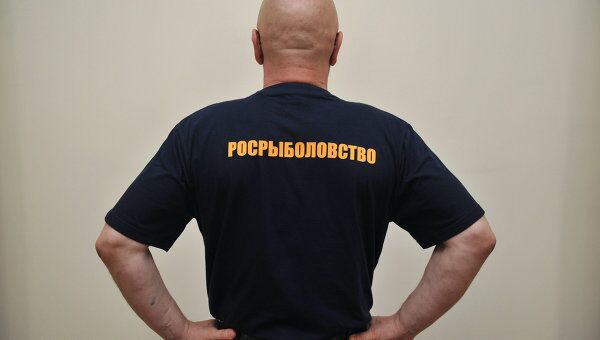 Форменная одежда для должных лиц Федерального агентства по рыболовству. Архивное фото Форменная одежда для должных лиц Федерального агентства по рыболовству. Архивное фото