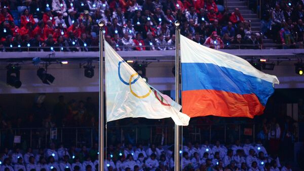 Олимпийский флаг и флаг России на Играх в Сочи Олимпийский флаг и флаг России на Играх в Сочи